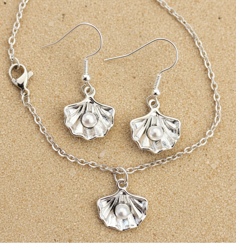 Muschel Perle Schmuckset Kette und Ohrringe silber auf weißem Hintergrund