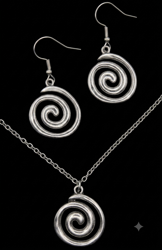 Schmuckset Spirale Edelstahl Kette und Ohrringe auf schwarzem Hintergrund